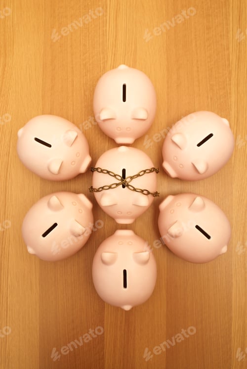 Preview: piggy banks surrounding piggy in chains