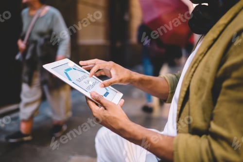 Preview: male with touch pad technology using 4g internet connection for browsing media content
