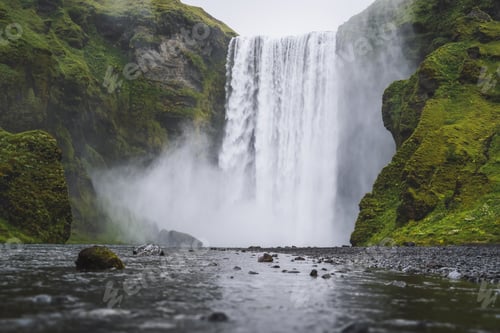 Preview: Beautiful Skogafoss waterfall. The most popular destination in Iceland. Water falling down a