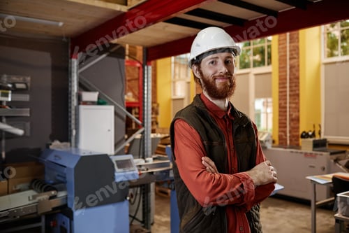 Preview: Man Wearing Hardhat at Factory