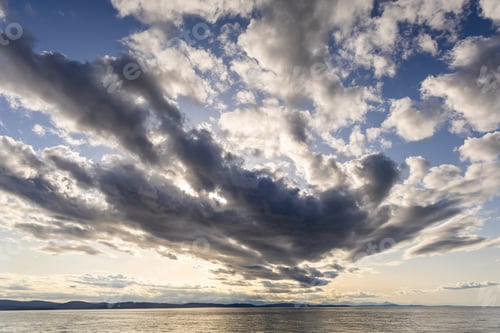 Preview: Dramatic Cloudscape Over Still Ocean on the West Coast of BC, Canada