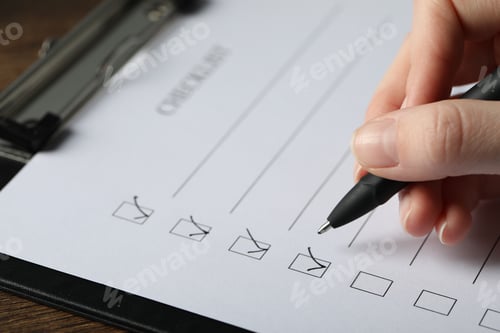 Preview: Woman filling Checklist with pen at table, closeup