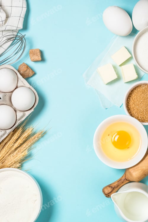 Preview: Baking ingredients at blue table top view.