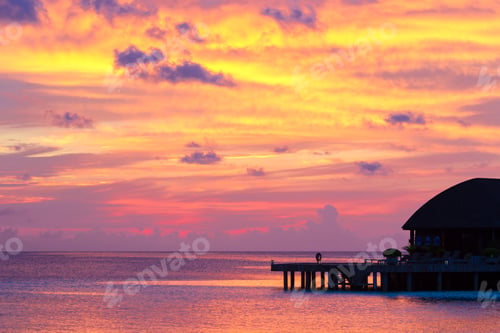 Preview: Beautiful colorful sunset at tropical island on Maldives in Indian Ocean