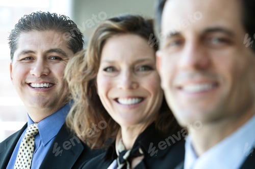 Preview: A closeup portrait of a row of multi ethnic business people, with focus on the hispanic businessman.
