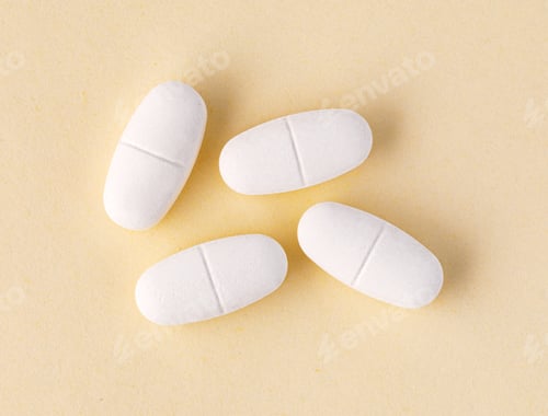 Preview: White oval pills representing medication and healthcare