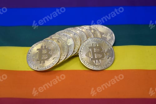 Preview: Closeup of bitcoins on an LGBT Pride flag