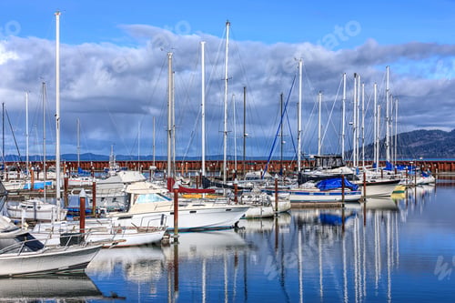 Preview: Boats casting reflections in the marina.