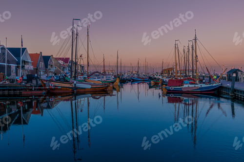 Preview: a number of sailboats in a body of water near one another