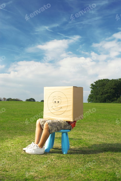 Preview: boy on stool with box on head