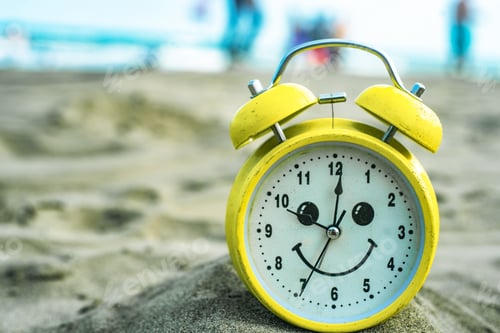 Preview: yellow clock on the beach vacation fun time