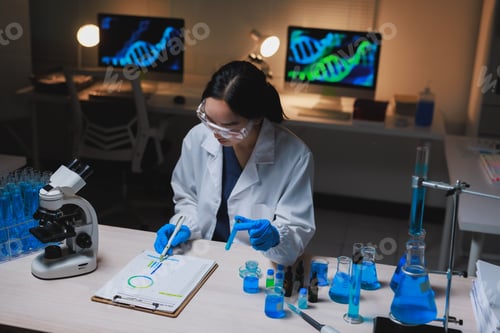 Preview: Scientist working in laboratory researching genetic data analysis