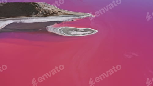 Preview: Aerial view of White salt on the shores of the island in Pink Island and blue sky . Lake Lemuria