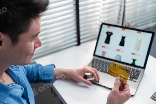 Preview: Asian active man use laptop computer for shopping product sell online.