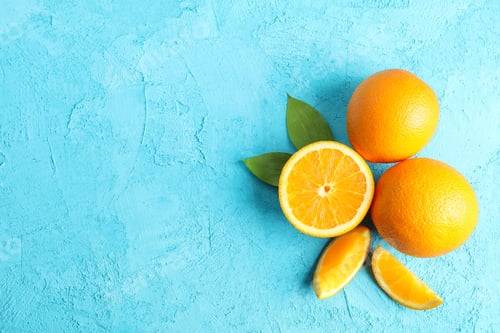 Preview: Flat lay composition with ripe oranges and leaves on color background. Top view, space for text