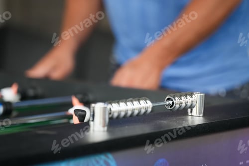 Preview: Closeup shot of the scoreboard for a foosball game as two people are playing