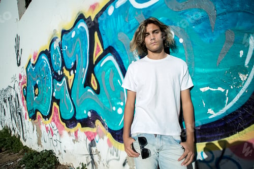 Preview: Young man near the blue wall