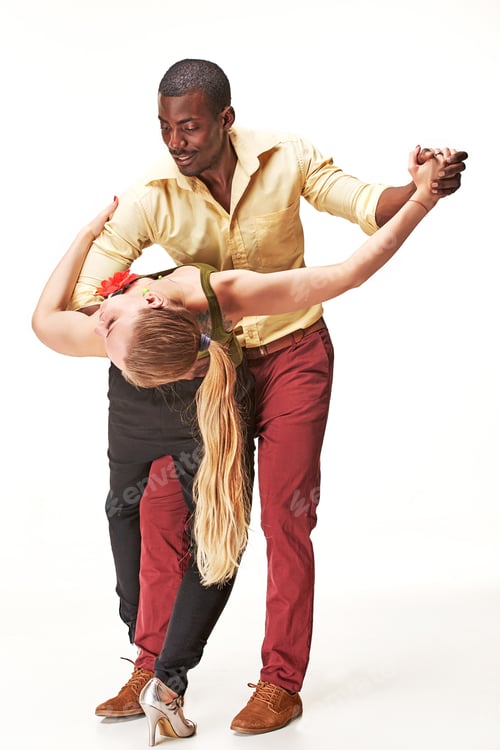 Preview: Young couple dances Caribbean Salsa, studio shot