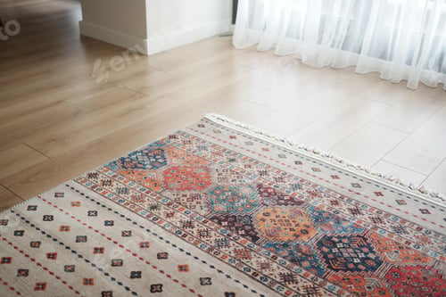 Preview: A patterned rug rests on the flooring beside a mirror