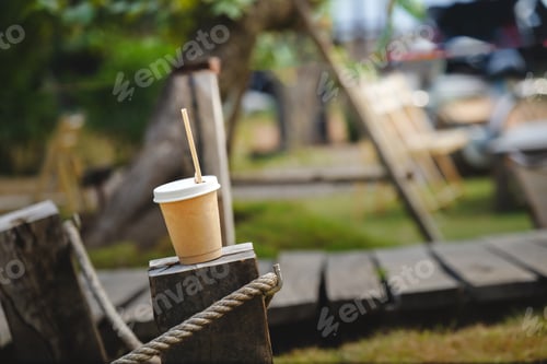 Preview: Takeaway Coffee on Rustic Table Outside