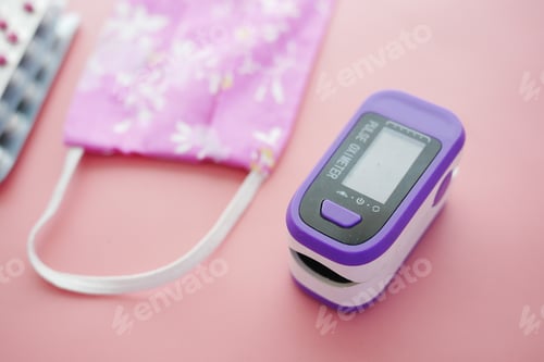Preview: pulse oximeter and face mask on pink