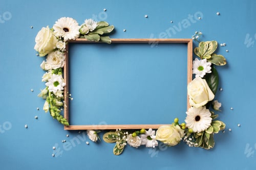 Preview: Frame of white flowers over blue background. Valentines day, Woman day concept. Spring or summer