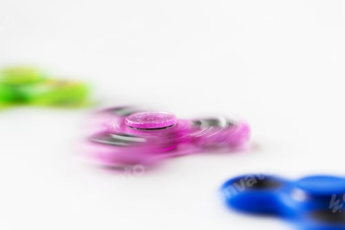 Preview: close up of spinning fidget spinners
