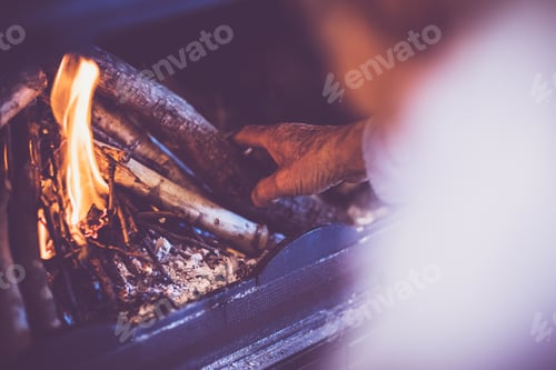 Preview: Man kindle a fire in the fireplace