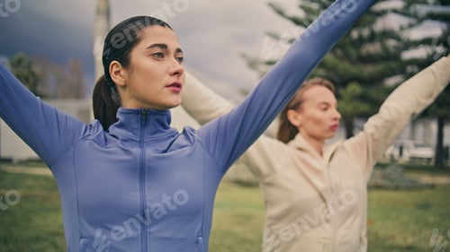 Preview: Empowered ladies morning gymnastic routine. Athlete women raising hands training