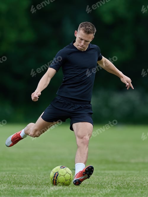 Preview: Football player kicking a ball