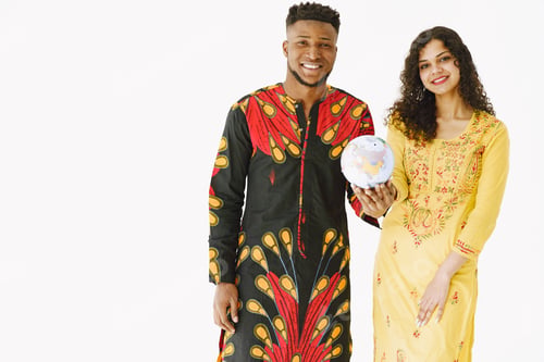 Preview: African man and Indian woman holding globe together