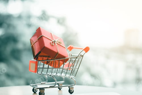 Preview: Gift box in small cart about shopping online concept.