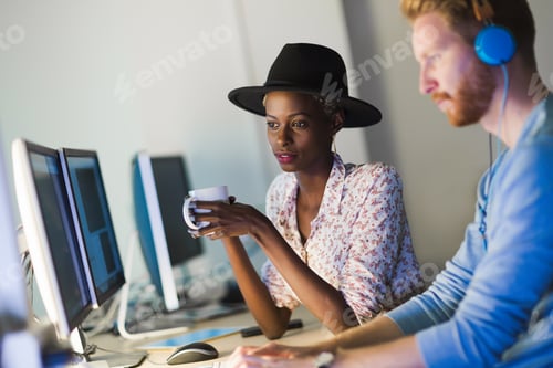 Preview: Programmers cooperating at information technology company