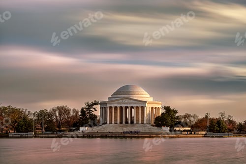 Preview: Jefferson Memorial framed by a serene sky and reflective water at dusk. Washington DC, WA, USA
