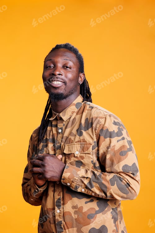 Preview: Smiling cheerful man smiling at camera