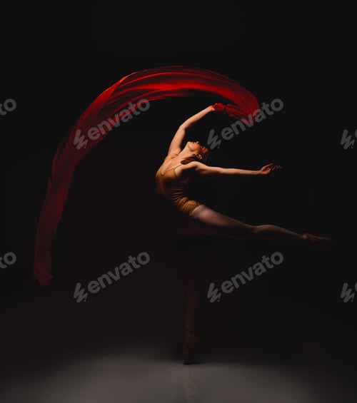 Preview: She lives for the arts. Shot of a performer dancing against a dark background.
