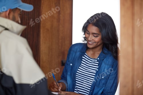 Preview: Just need your signature...Shot of a courier making a delivery to a smiling female customer.