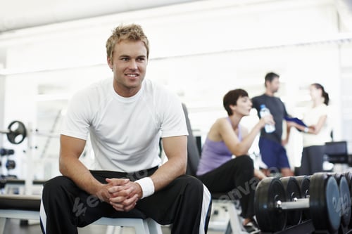 Preview: What next...Cropped shot of a handsome young man sitting in the gym.