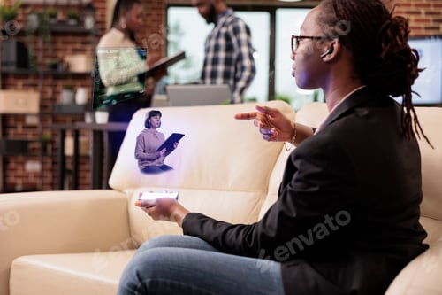 Preview: Startup worker talking to ai hologram