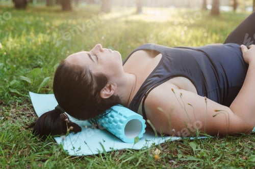 Preview: A charming brunette woman plus-size body positive practices sports in nature. Woman is engaged with
