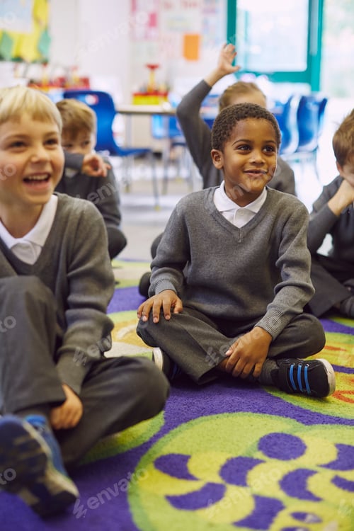 Preview: Children enjoying story time on a colorful classroom rug.