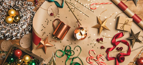Preview: Hot chocolate and Christmas decoration over wooden background, wide composition