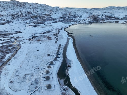 Preview: Glamping Domes on Snowy Shore by River Mouth Aerial Editorial