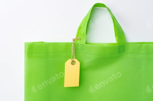 Preview: Blank paper tag with shopper paperbag on white background