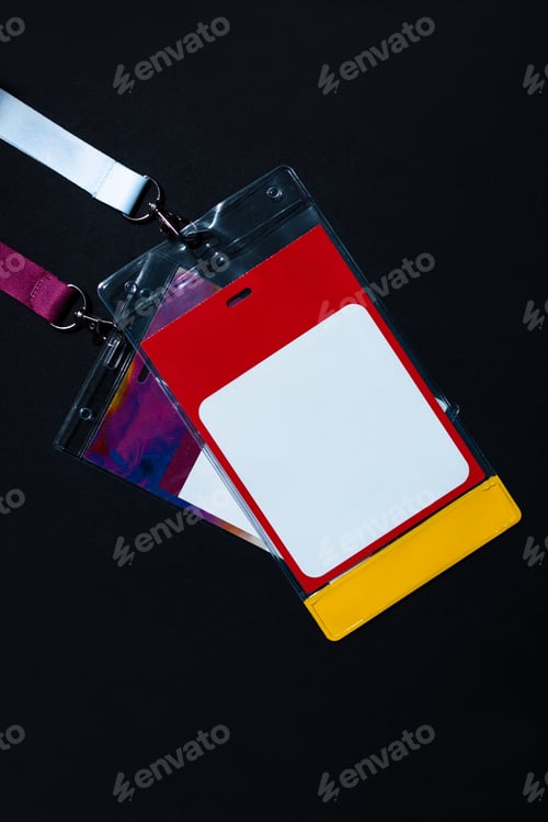 Preview: Blank ID badge with red, white, and yellow design on a white lanyard