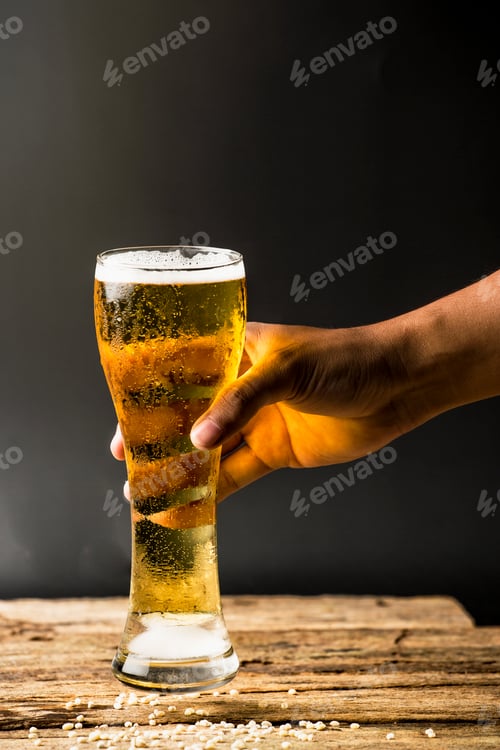 Preview: beer in a glass on dark background
