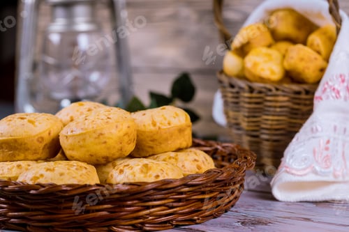 Preview: Brazilian cheese bread, chipa in basket on table.