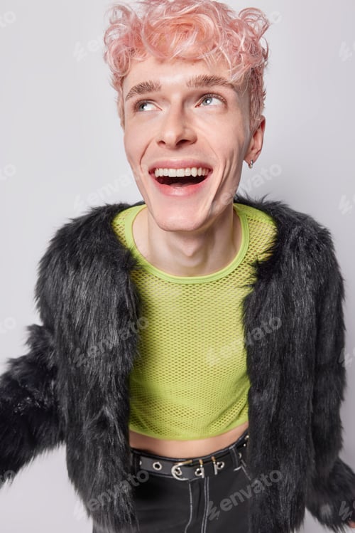 Preview: Genderqueer or bigender. Cheerful male gay laughs gladfully feels carefree has funny facial