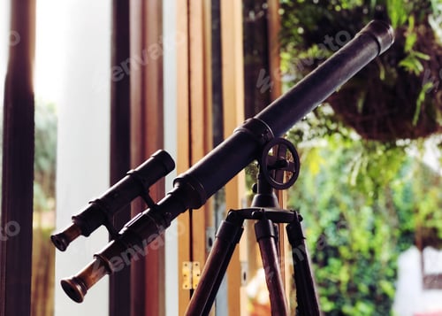 Preview: Black telescope in room blur background