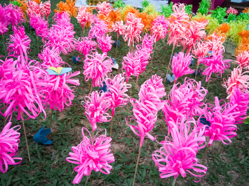 Preview: pink flowers made from recycled paper in the garden